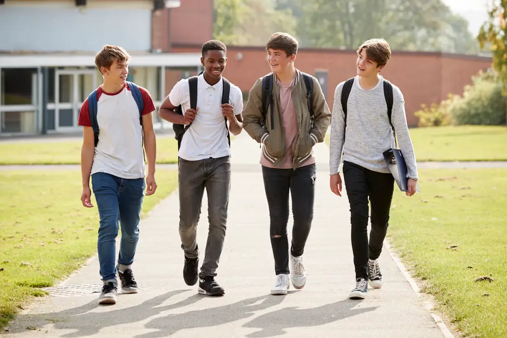 group of male teenage students walking around coll pm9wfq5.jpg