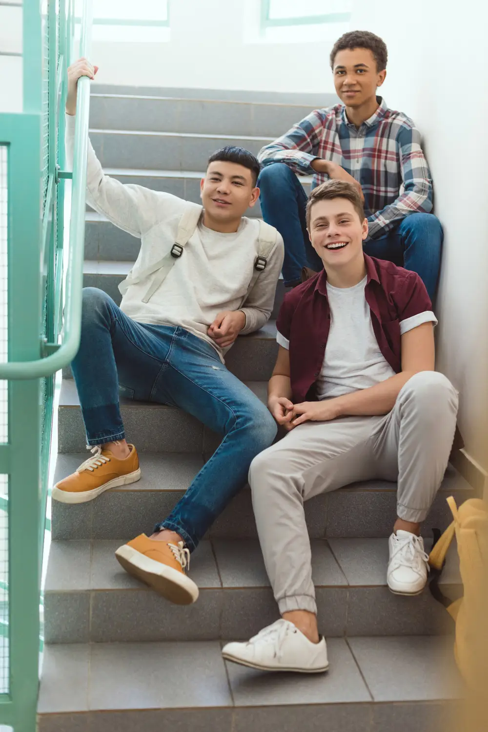 teenage schoolboys sitting on stairs at school and l4mn3ul.jpg