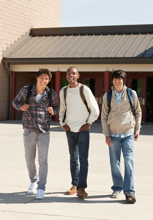 three friends laughing and walking together outsid ryjskde.jpg